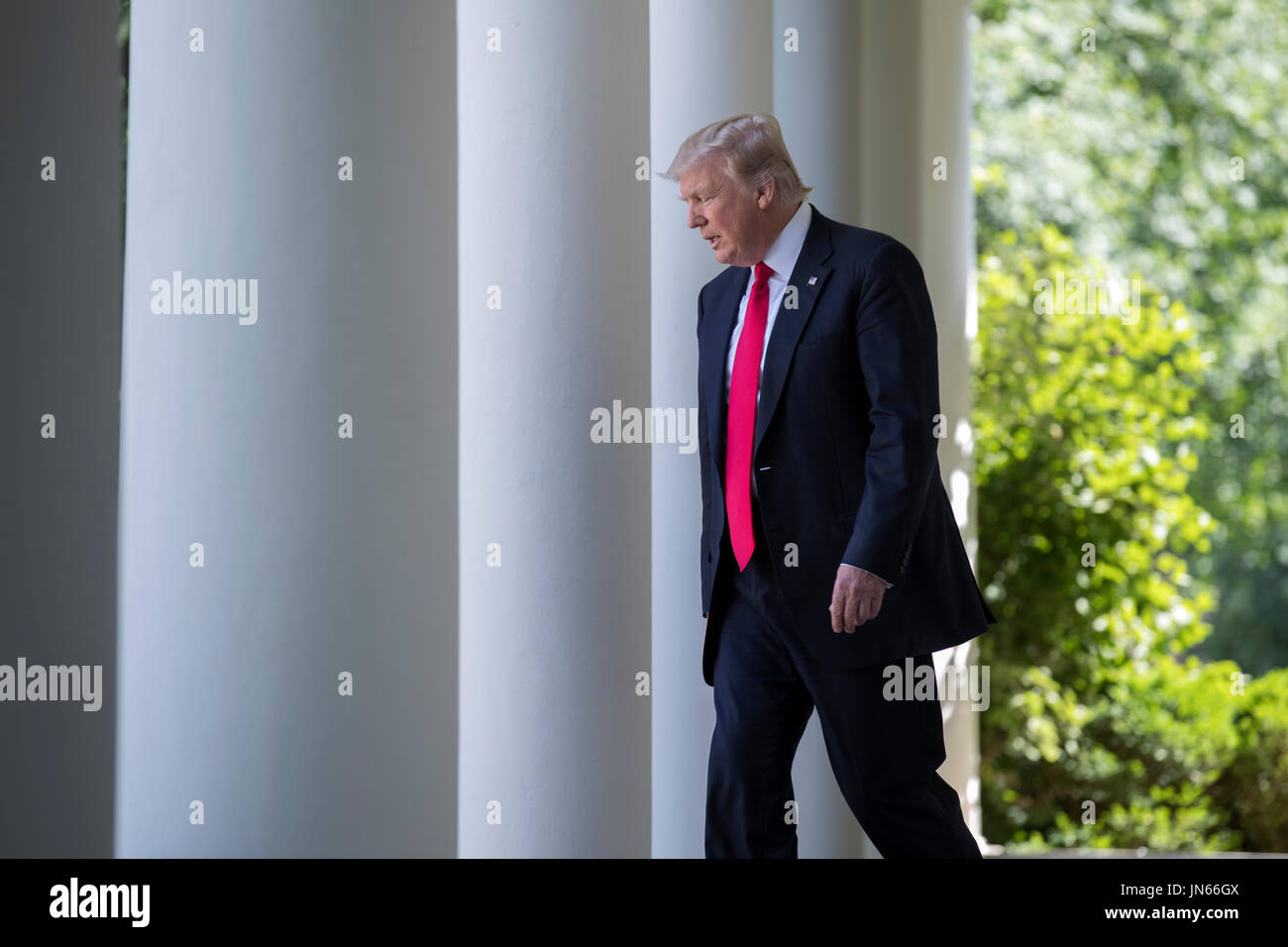 US President Donald J. Trump walks from the Oval Office to announces ...