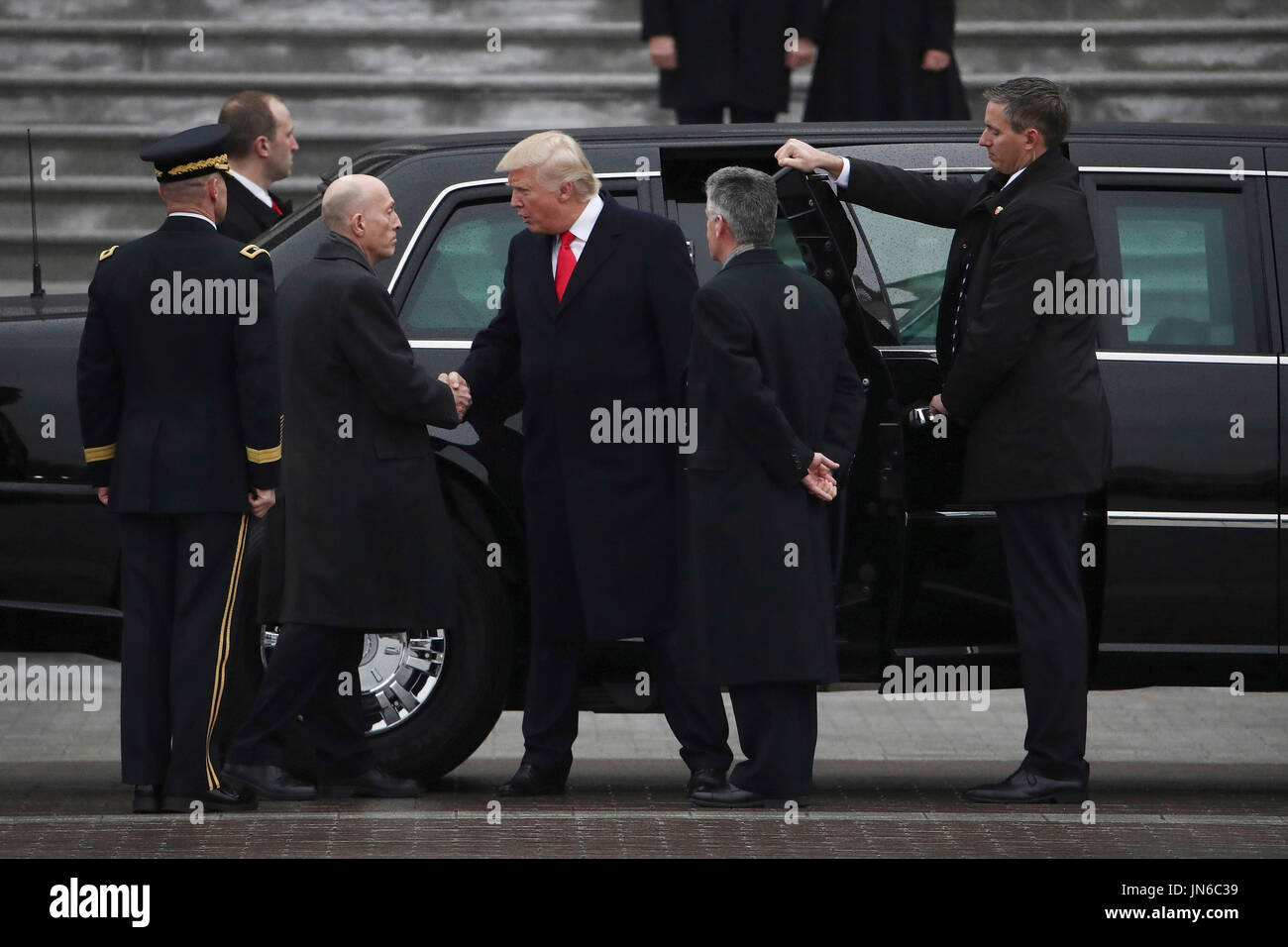 United States President Donald Trump shakes hands with House Sergeant