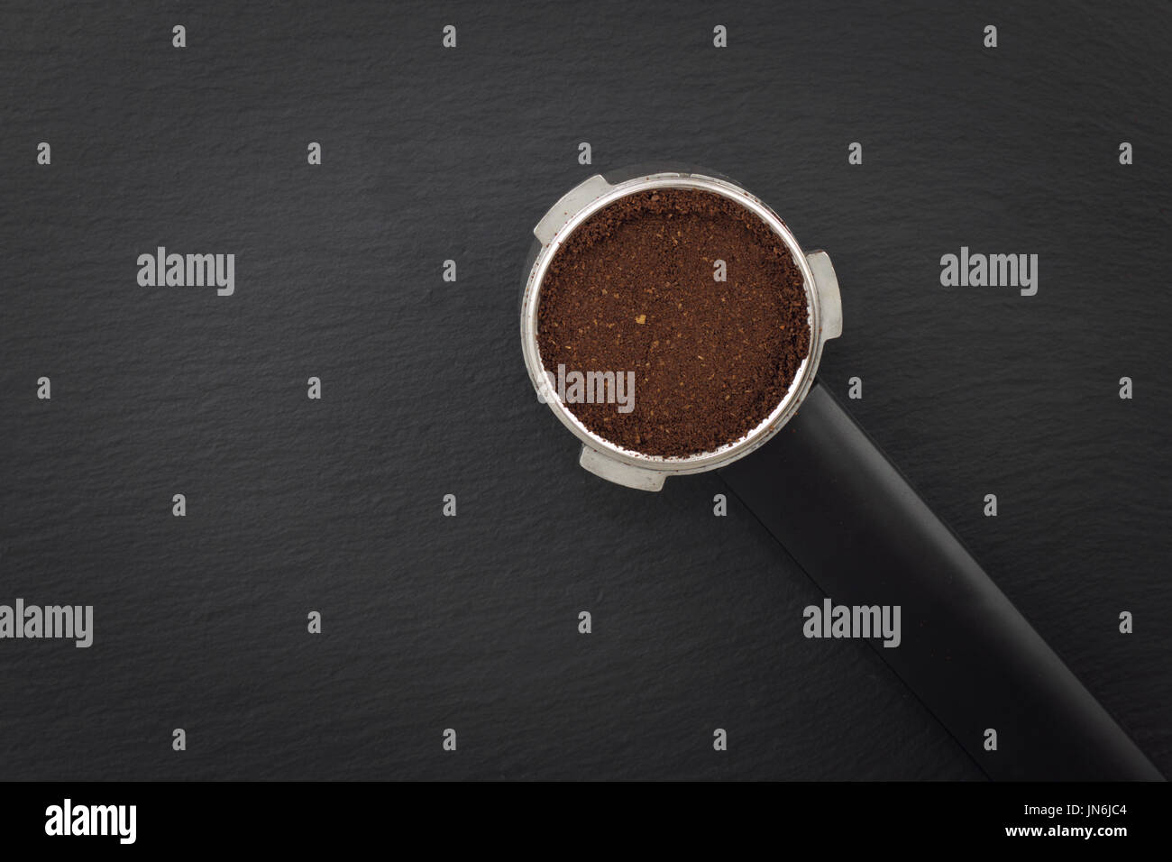 Espresso filter holder for coffee machine  on Black background with copy space Stock Photo