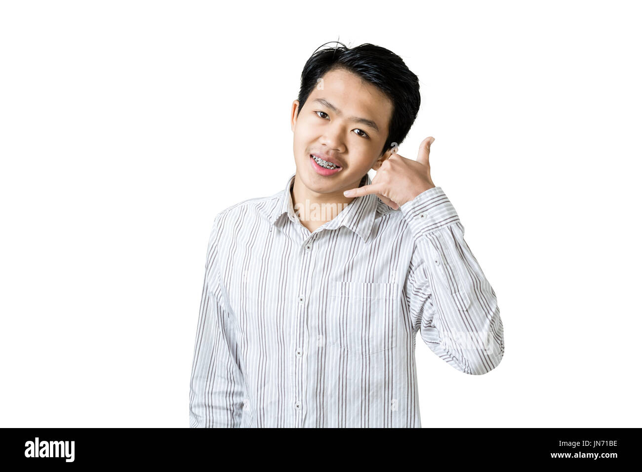 Portrait of a young businessman making a calling sign with his hands ...