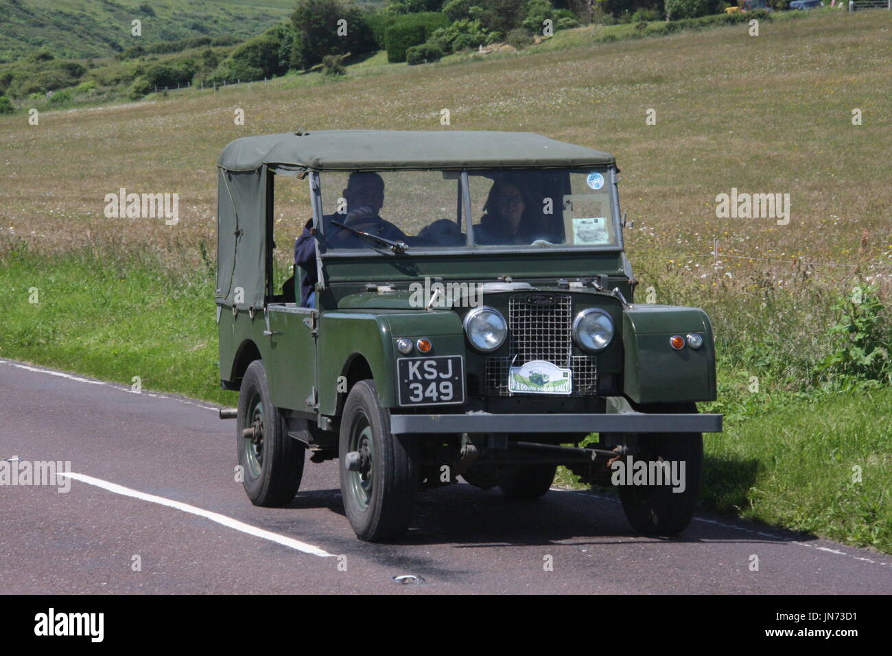 A SUNNY LANDSCAPE VIEW OF A LAND ROVER SERIES 1 ON A CLASSIC EVENT ...
