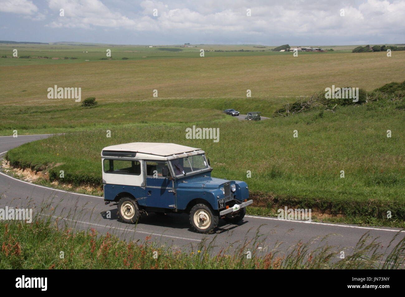 A SUNNY LANDSCAPE VIEW OF A LAND ROVER SERIES 1 ON A CLASSIC EVENT ...