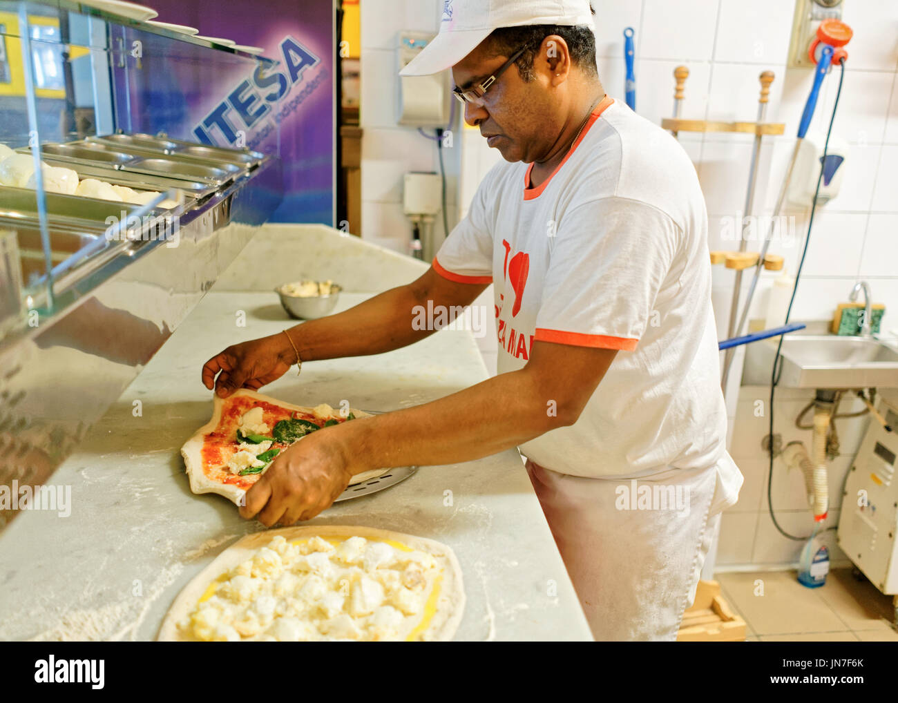 Florence, Italy October 15, 2016 Chef preparing Margherita pizza at
