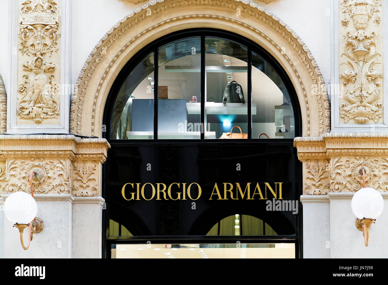 Giorgio Armani logo of store in Milans Fashion District. Montenapoleone  area. Giorgio Armani is a high-end label specializing in accessories,  glasses, cosmetics. Milan, Italy - 24.09.2020 – Stock Editorial Photo ©  photo-lime #418068596