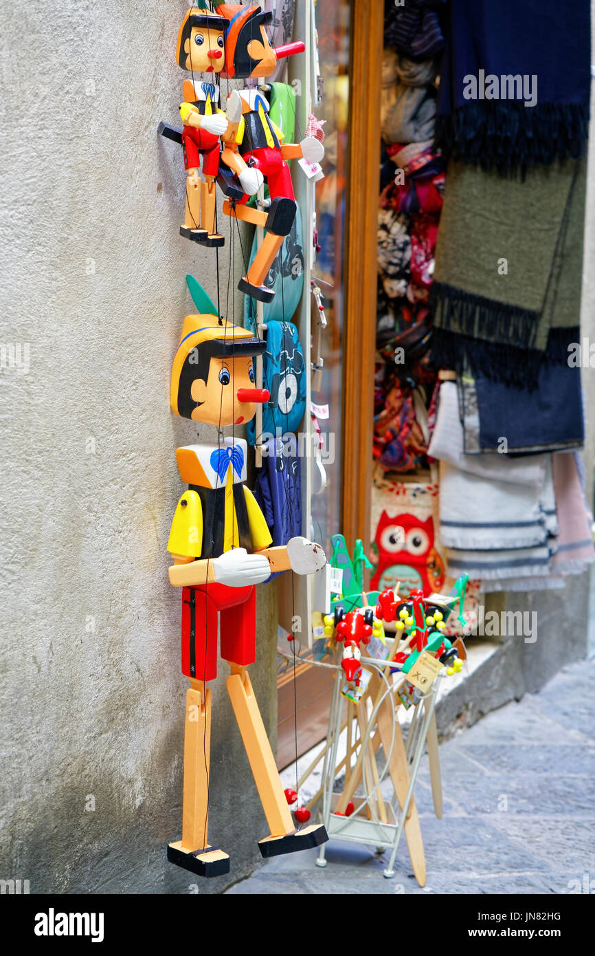 Siena, Italy - October 19, 2016: Street souvenir shop with wooden Pinocchio puppets in the Old town of Siena, Tuscany, Italy Stock Photo