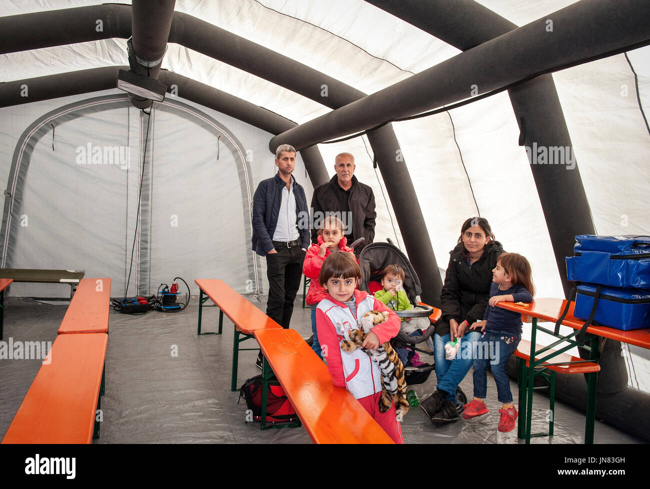 Munich-Germany- September 21, 2015 Refugees from Afghanistan in an isolation tent in the center for refugees in Munich. They seek asylum in Europe. Stock Photo