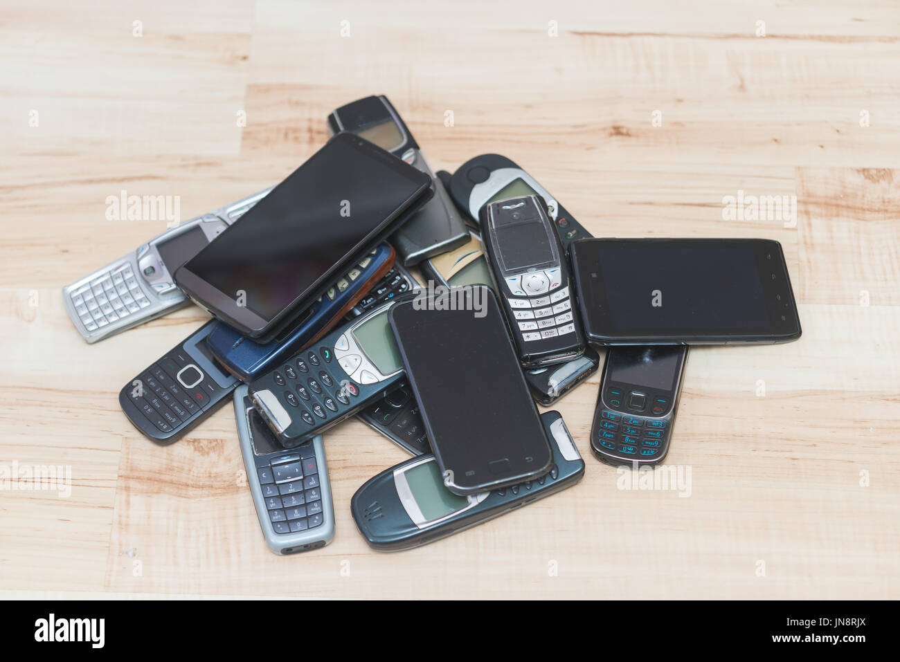 Pile of mobile phones. Old and new models Stock Photo