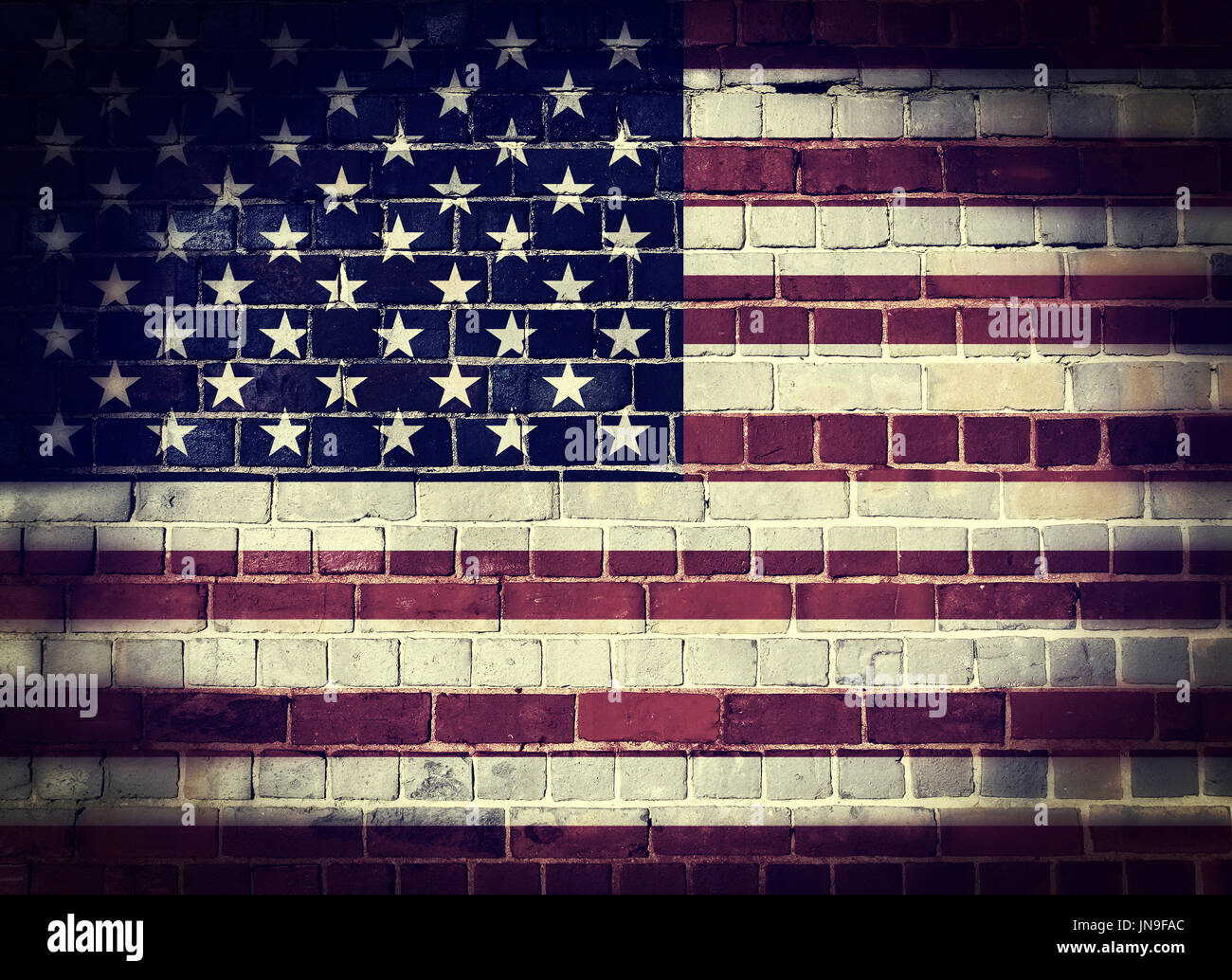 Desaturated United States of America flag on a brick wall background ...