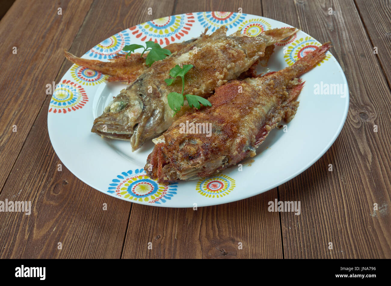 Salmonetes con fritura Andaluza. Fried in a frying pan fish, Spanish cuisine Stock Photo