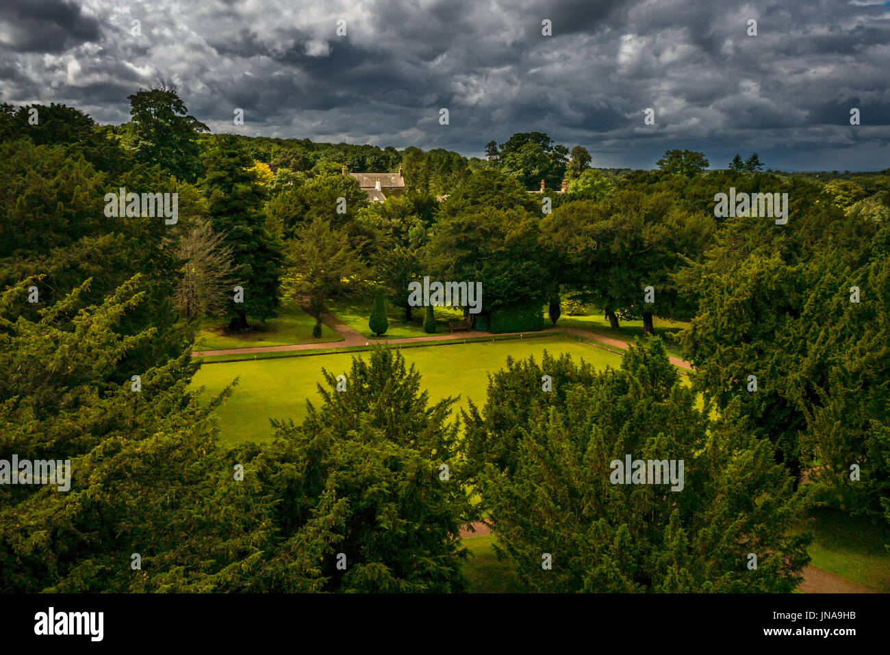 View across the bowling green at Dirleton Castle with dramatic moody sky, East Lothian, Scotland, UK Stock Photo