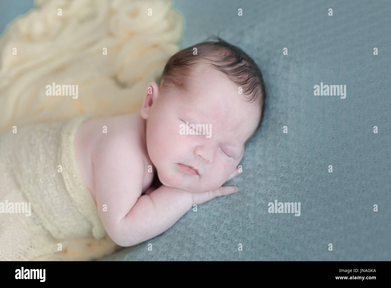Sleeping newborn baby girl swaddled in a blanket Stock Photo Alamy
