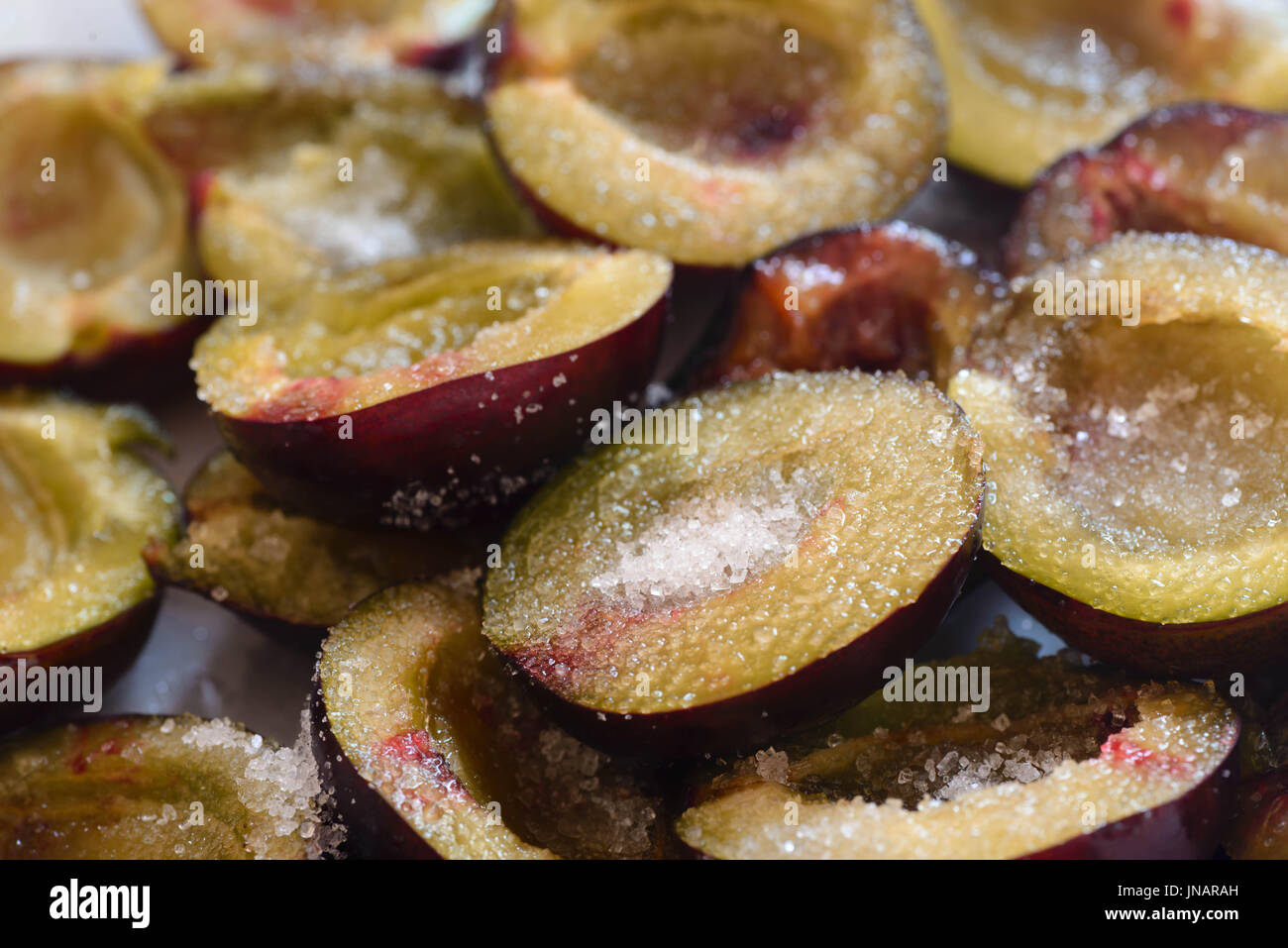 closeup to plum fruits with sugar Stock Photo