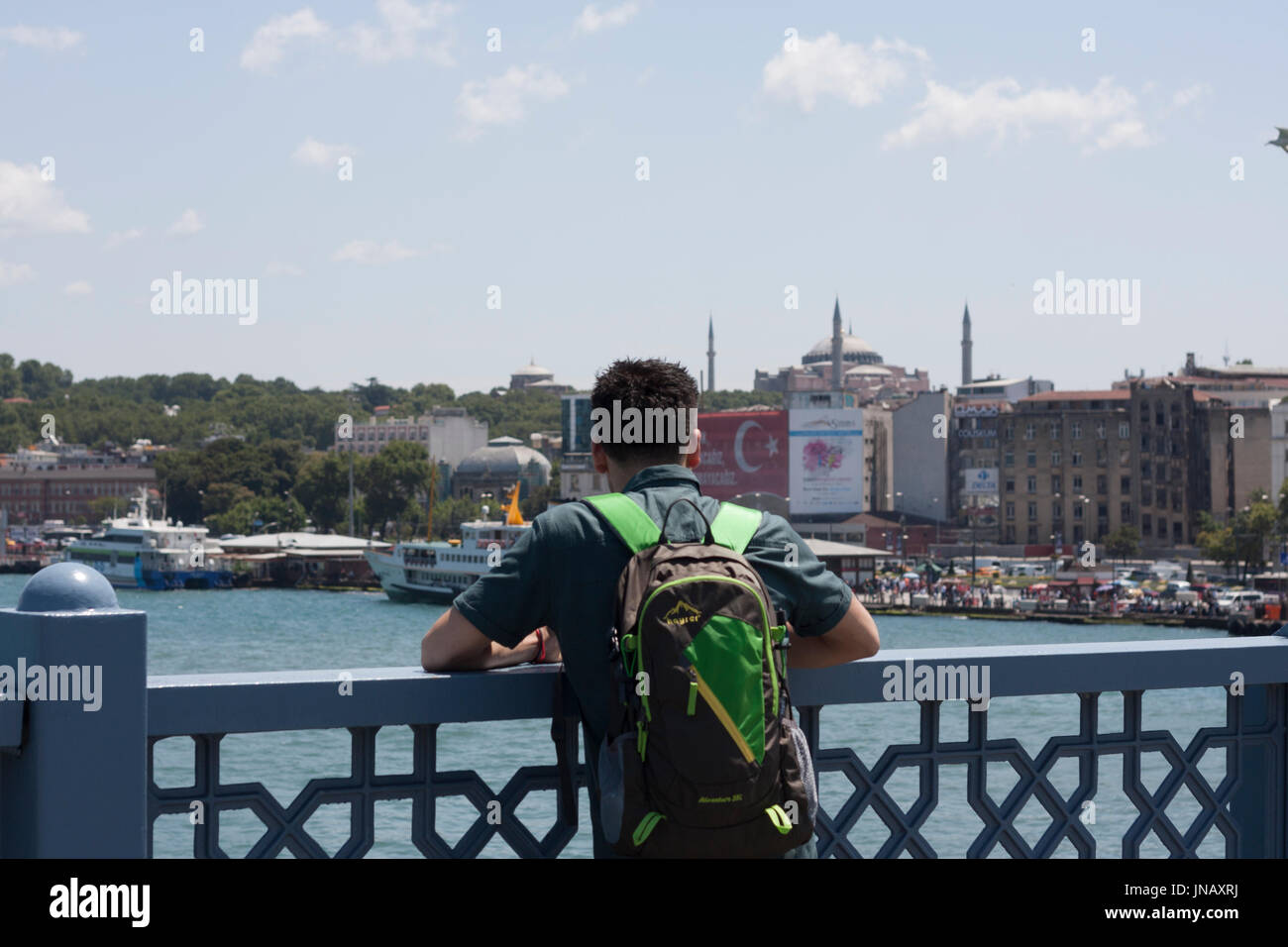 Istanbul, Turkey - July 19, 2017 Tourist Man Hagia Sophia Istanbul from Galata Bridge Stock Photo
