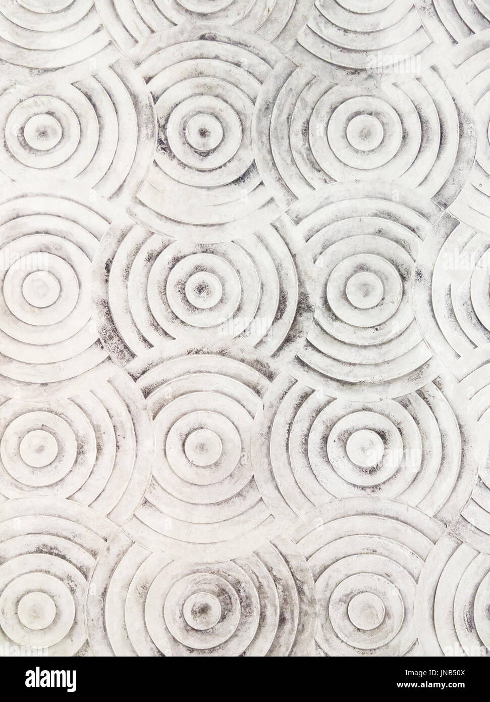 Circle pattern on the concrete floor of the paving near the urban shopping mall. Stock Photo