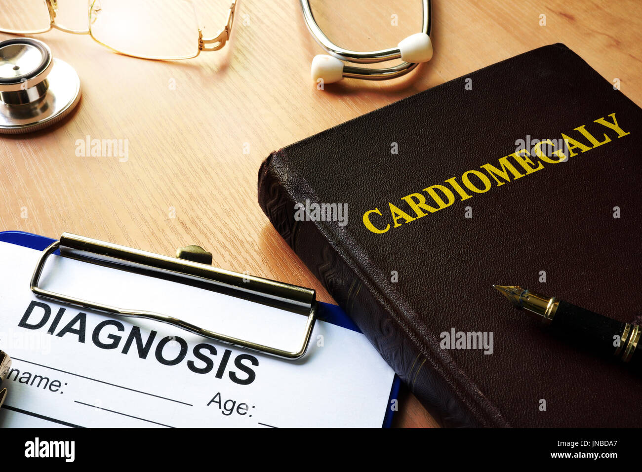 Cardiomegaly written on a front a book. Stock Photo