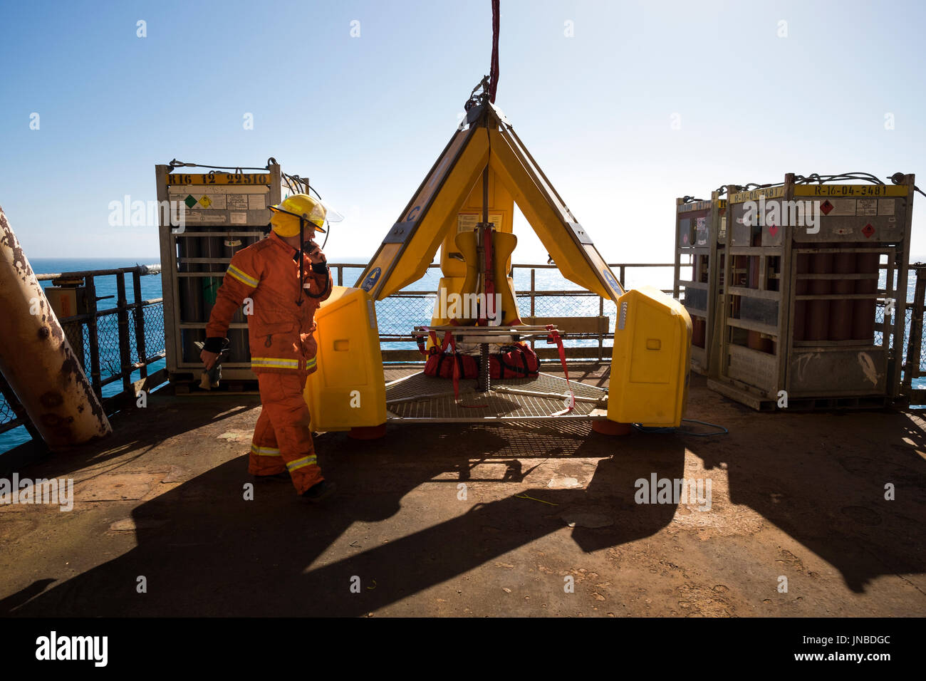 Fire team on north sea oil gas rig, practicing weekly emergency response drills. credit: LEE RAMSDEN / ALAMY Stock Photo