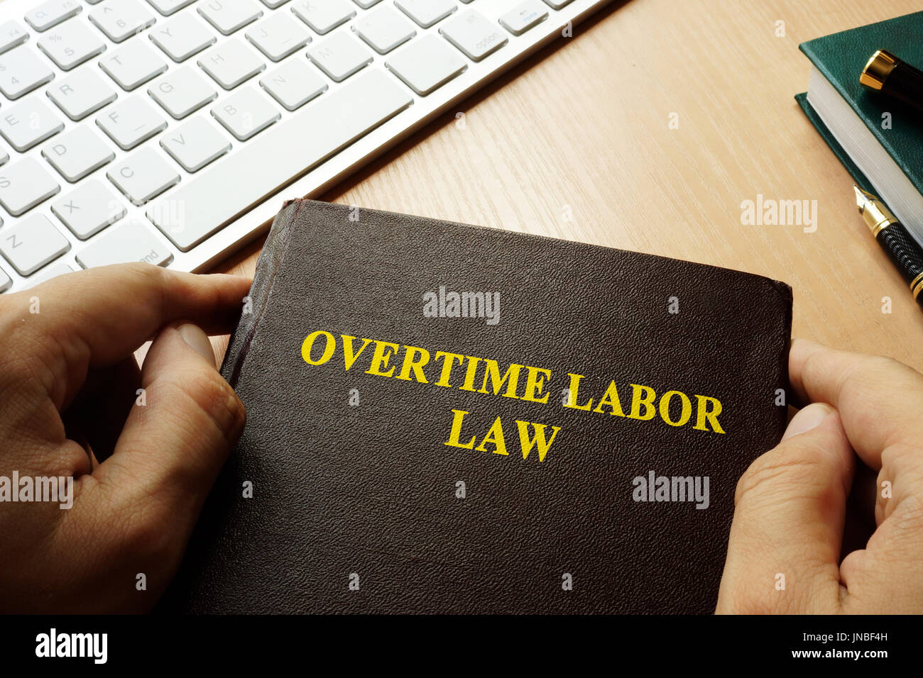 Book with title overtime labor law. Stock Photo