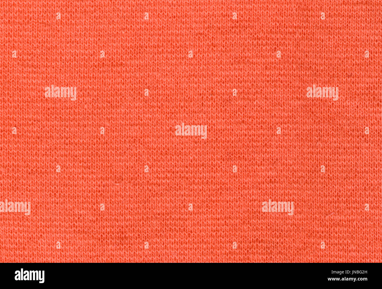 Stretch Viscose Fabric. Coral color texture backdrop high resolution Stock Photo