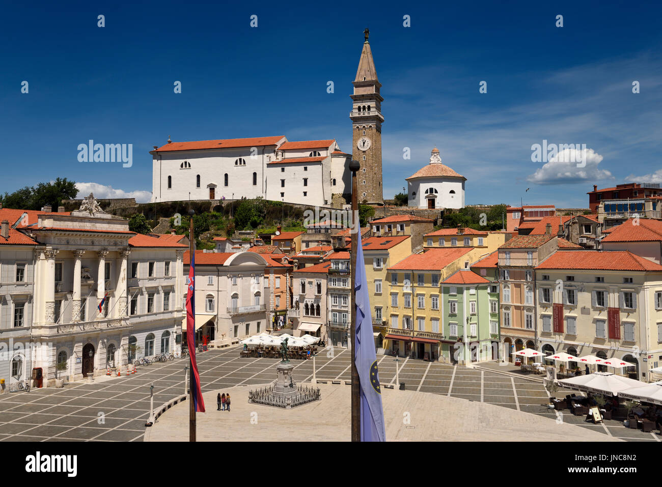 Elevated view of Tartini Square in Piran Slovenia with City Hall, St. George's Roman Catholic Cathedral with clock bell tower and baptistery Stock Photo