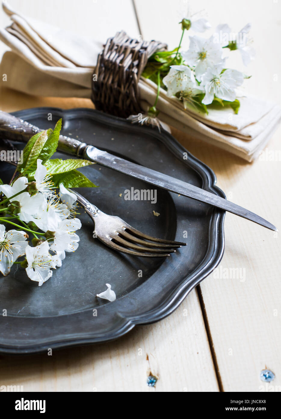 Spring time table setting with rustic plates and cherry blossom Stock ...