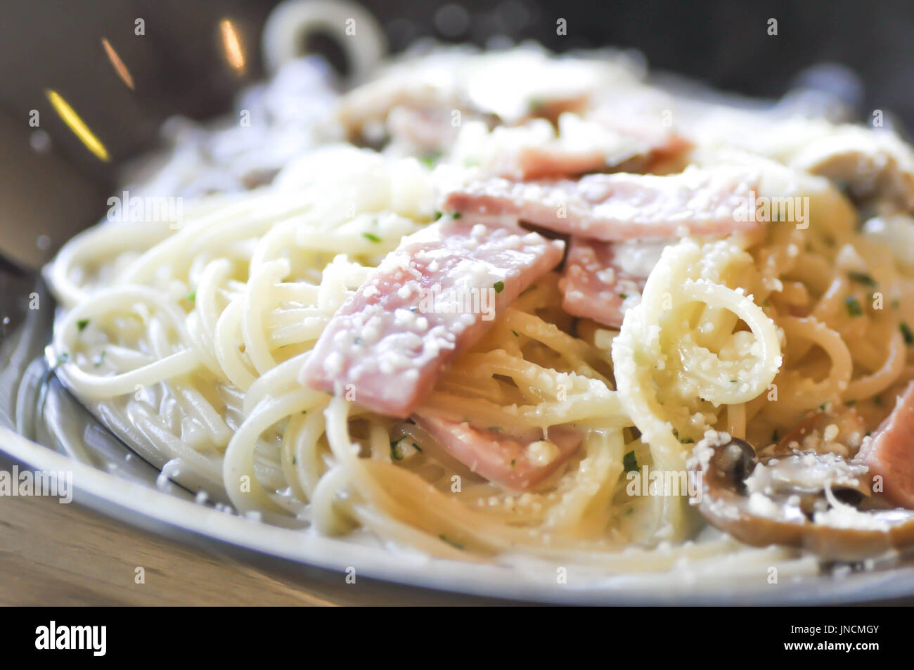 spaghetti carbonara with mushroom and ham Stock Photo Alamy