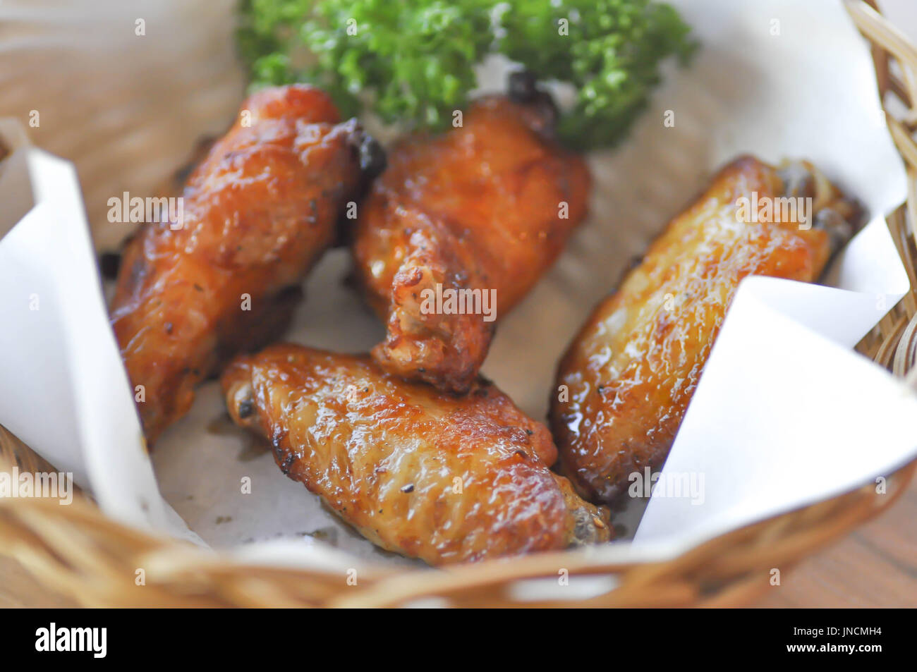 fried chicken or chicken wing in a basket Stock Photo Alamy