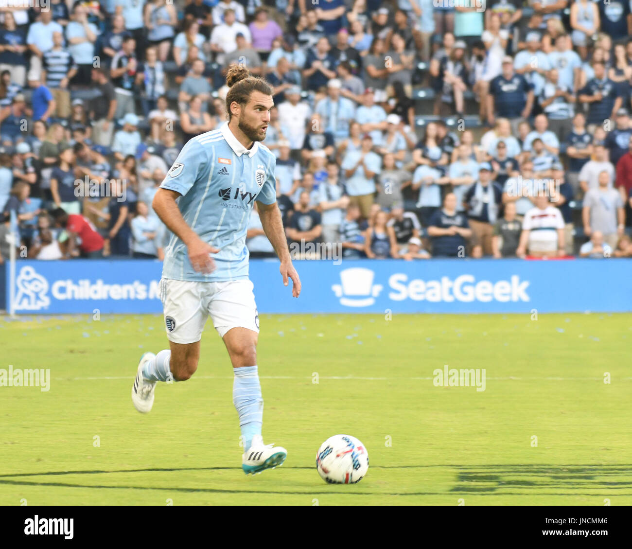 KANSAS CITY, KS - JULY 29: Sporting Kansas City midfielder Graham Zusi (8) in the first half of an MLS match between the Chicago Fire and Sporting KC Stock Photo