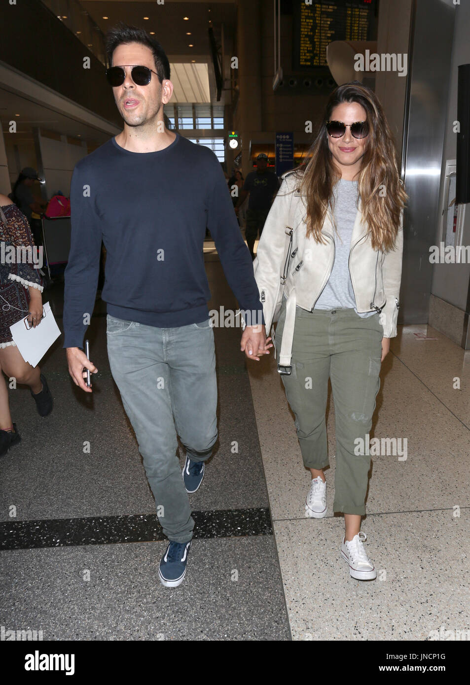 Eli Roth and his wife Lorenza Izzo arrive at Los Angeles International ...