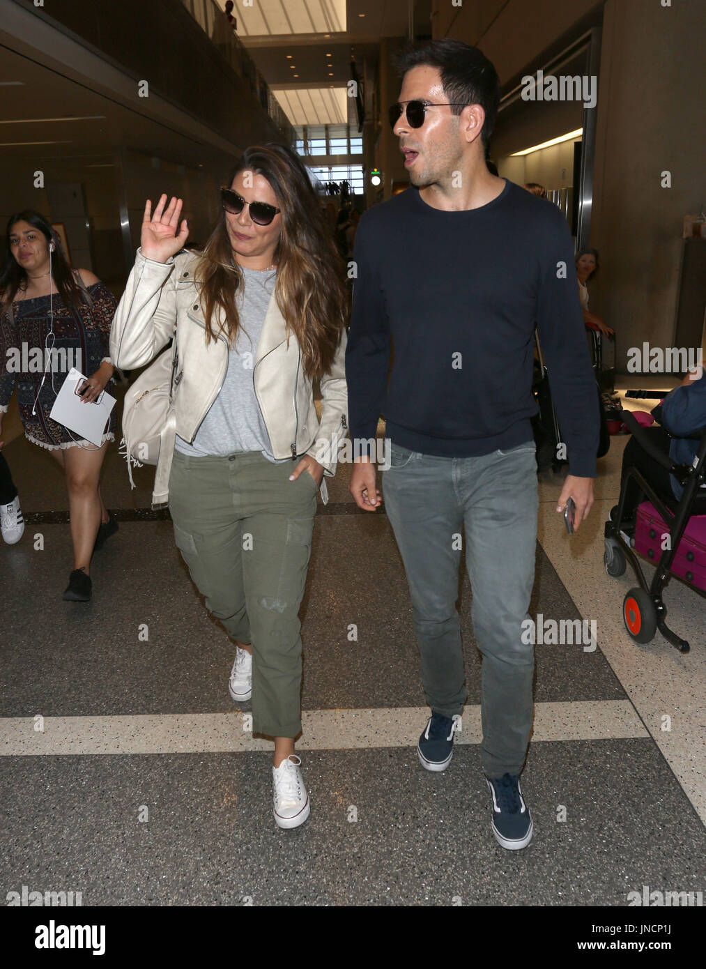 Eli Roth and his wife Lorenza Izzo arrive at Los Angeles International ...