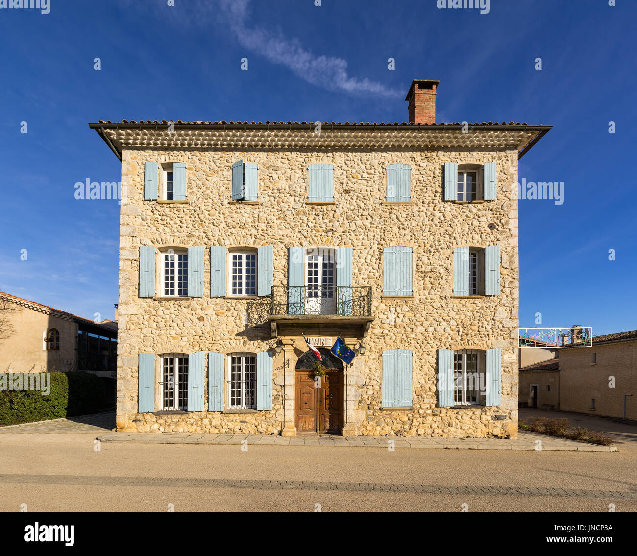 Town Hall stone facade of Lagrand and wooden door. Hautes-Alpes, France Stock Photo