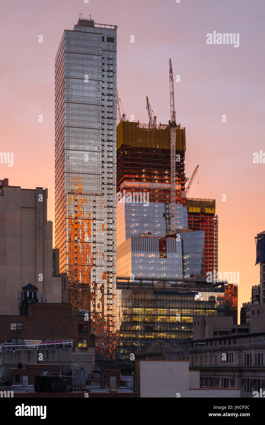 The Hudson Yards construction site (2017) and The Eugene skyscrapers at sunset. Midtown, Manhattan, New York City Stock Photo