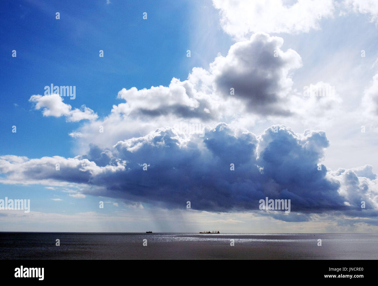 A rain shower out at sea on the North East coast Stock Photo - Alamy