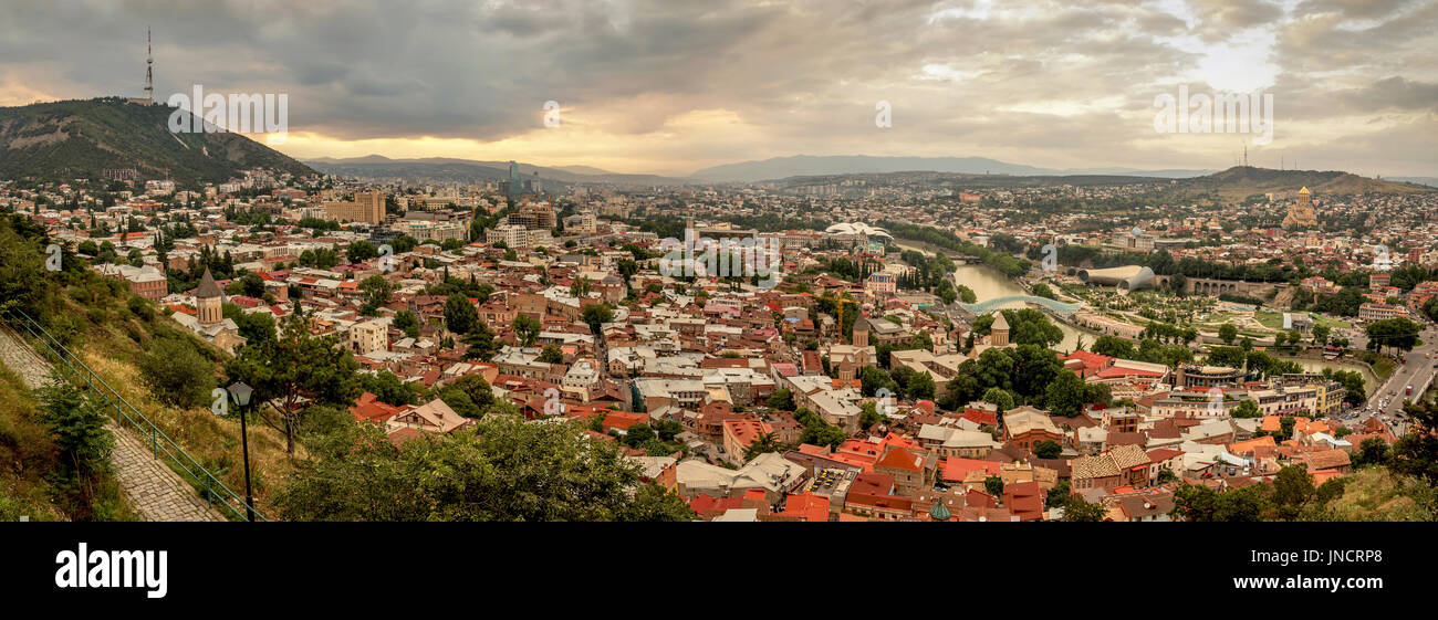 Panoramic view of Tbilisi, the capital of Georgia with old town and modern architecture during sunset. Stock Photo