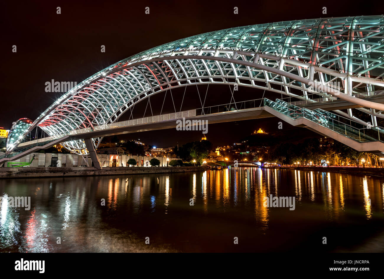 Night view of The Bridge of Peace over river Kura, Tbilisi, Georgia Stock Photo