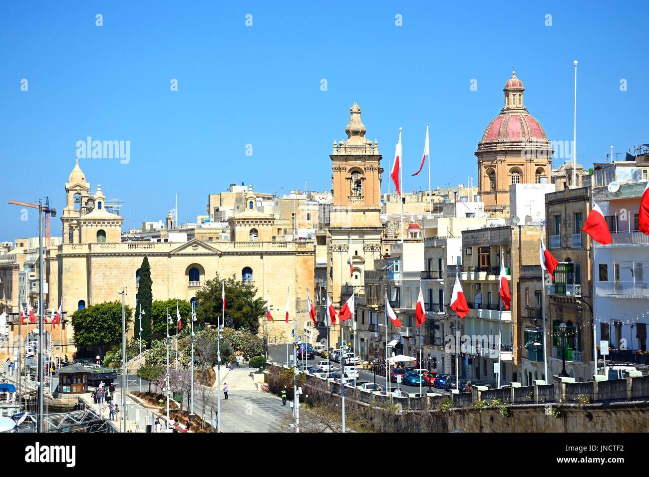 Elevated view along the waterfront buildings towards St Lawrence church, Vittoriosa (Birgu), Malta, Europe. Stock Photo