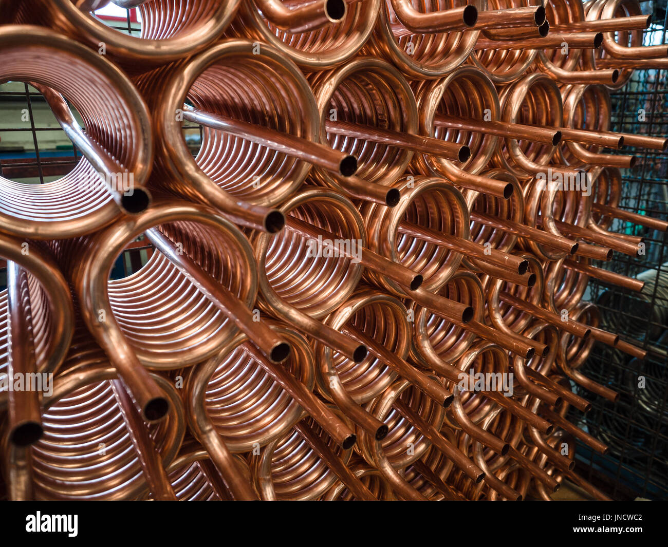 Heat exchangers obtained by winding copper pipe Stock Photo Alamy