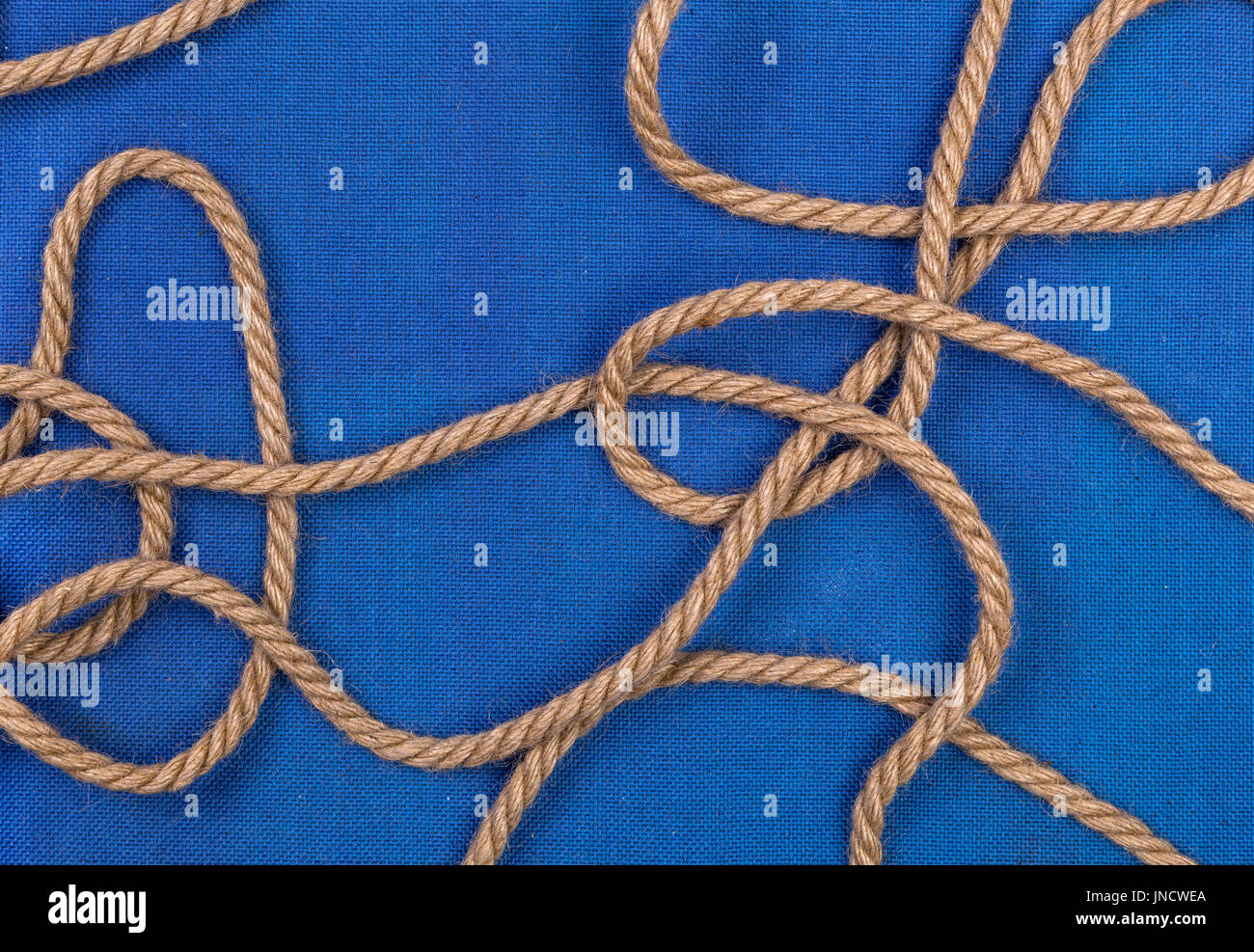 Ship rope on blue background, top view with copy space Stock Photo