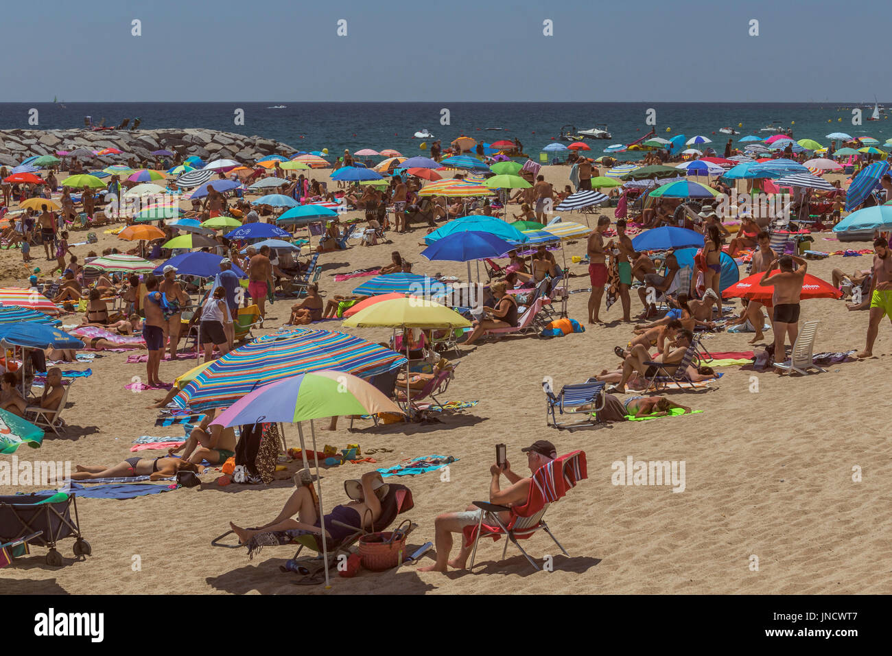 Beach life in a small spanish town Palamos (Spain,Costa Brava), July 27, 2017, Spain Stock Photo