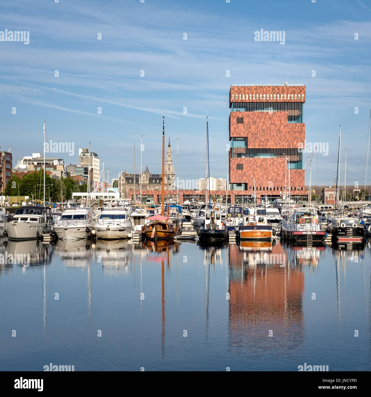 Contextual view on the MAS museum reflected in a dock (Willemdok) in Antwerp, Saturday 22 July 2017, Antwerp, Belgium. Stock Photo