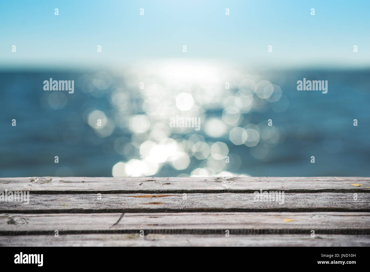 Beautiful summer background, view of the sea from the wooden pier Stock Photo