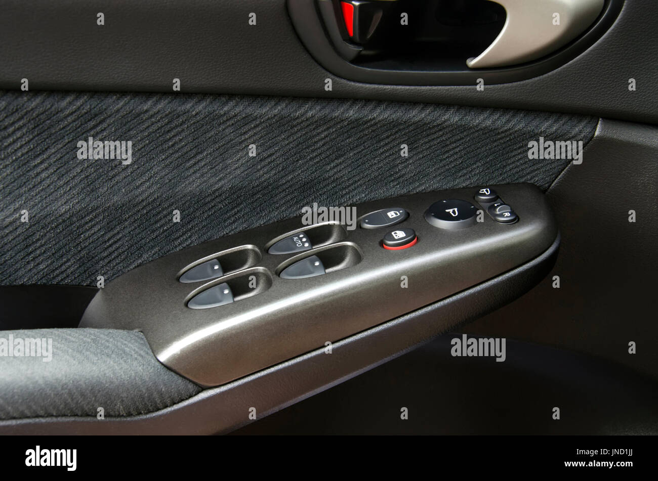 Car armrest with window control buttons Stock Photo Alamy