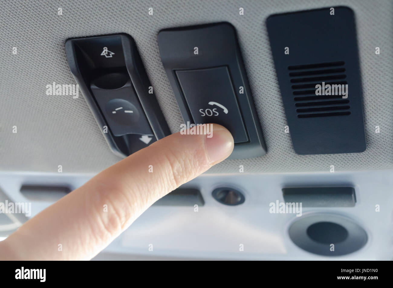 Finger pressing emergency sos button to contact with call center to ask for help after car accident Stock Photo