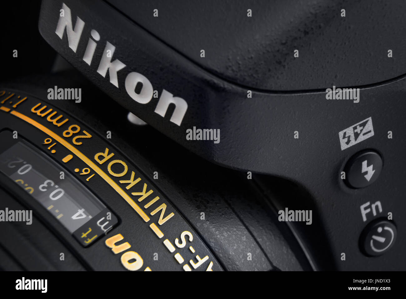 Warsaw, Poland - December 31, 2016: Digital SLR professional Nikon camera with Nikkor lens. Close-up view. Image in dark Stock Photo