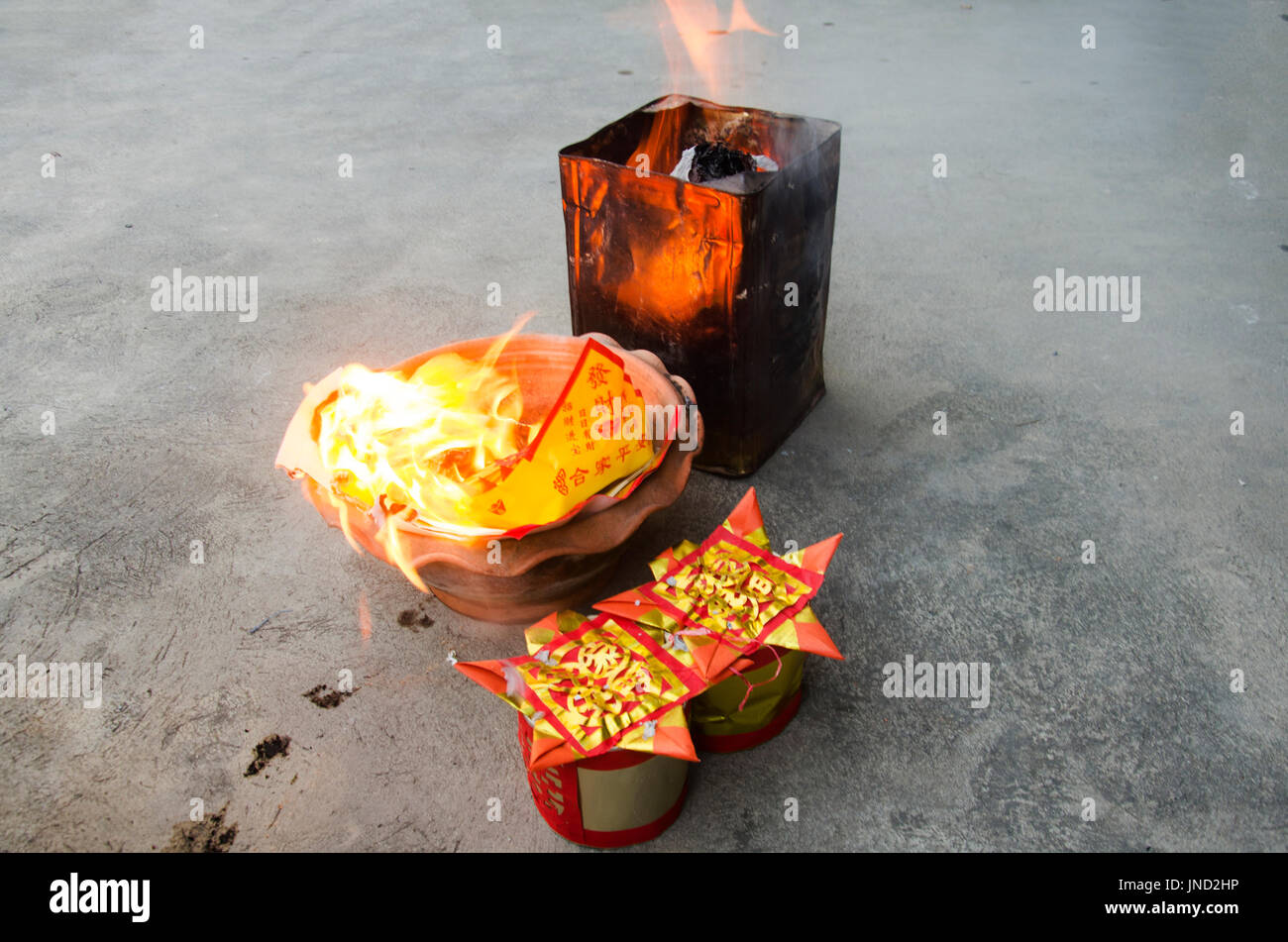 People burn joss paper gold and silver paper for worship with paper