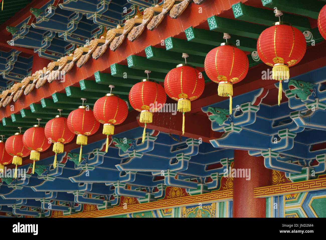 red lanterns hanging from Buddhist temple roof Stock Photo