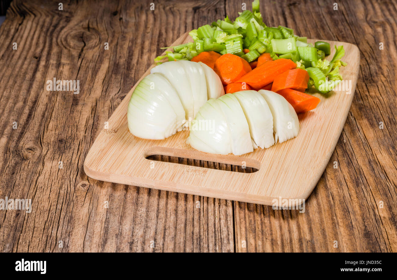 Vegetable Mirepoix Of Carrots Celery And Onions On A Cutting Board Stock Photo Alamy