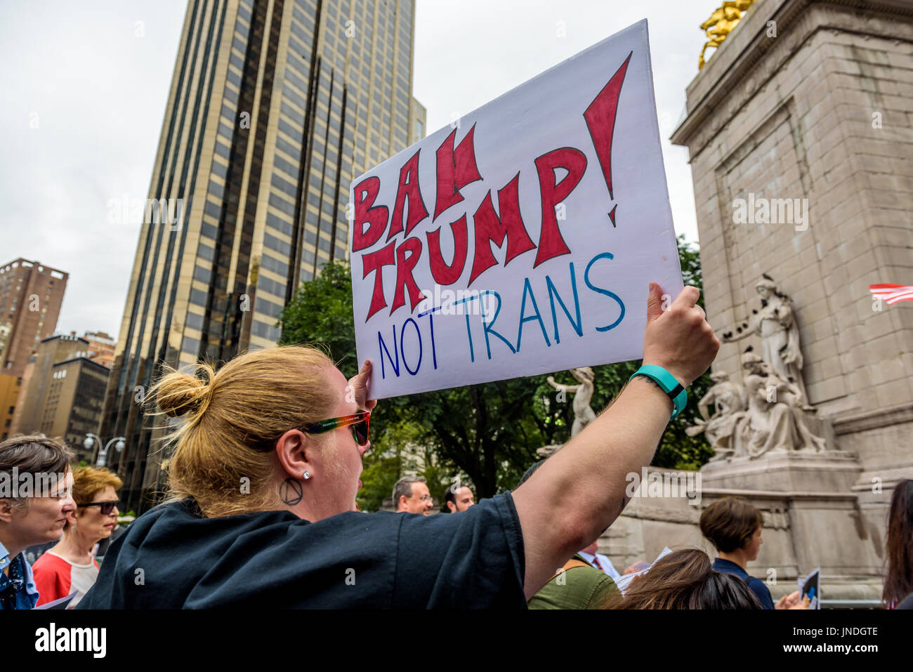 New York, United States. 29th July, 2017. A group of New Yorkers gathered at Columbus Circle across the Trump International Hotel and Tower New York in Central Park to raise their voices in protest against discrimination towards the LGBT community, in the aftermath of the Trump/Pence regime decision to ban transgender people from serving in the U.S. military. Credit: Erik McGregor/Pacific Press/Alamy Live News Stock Photo