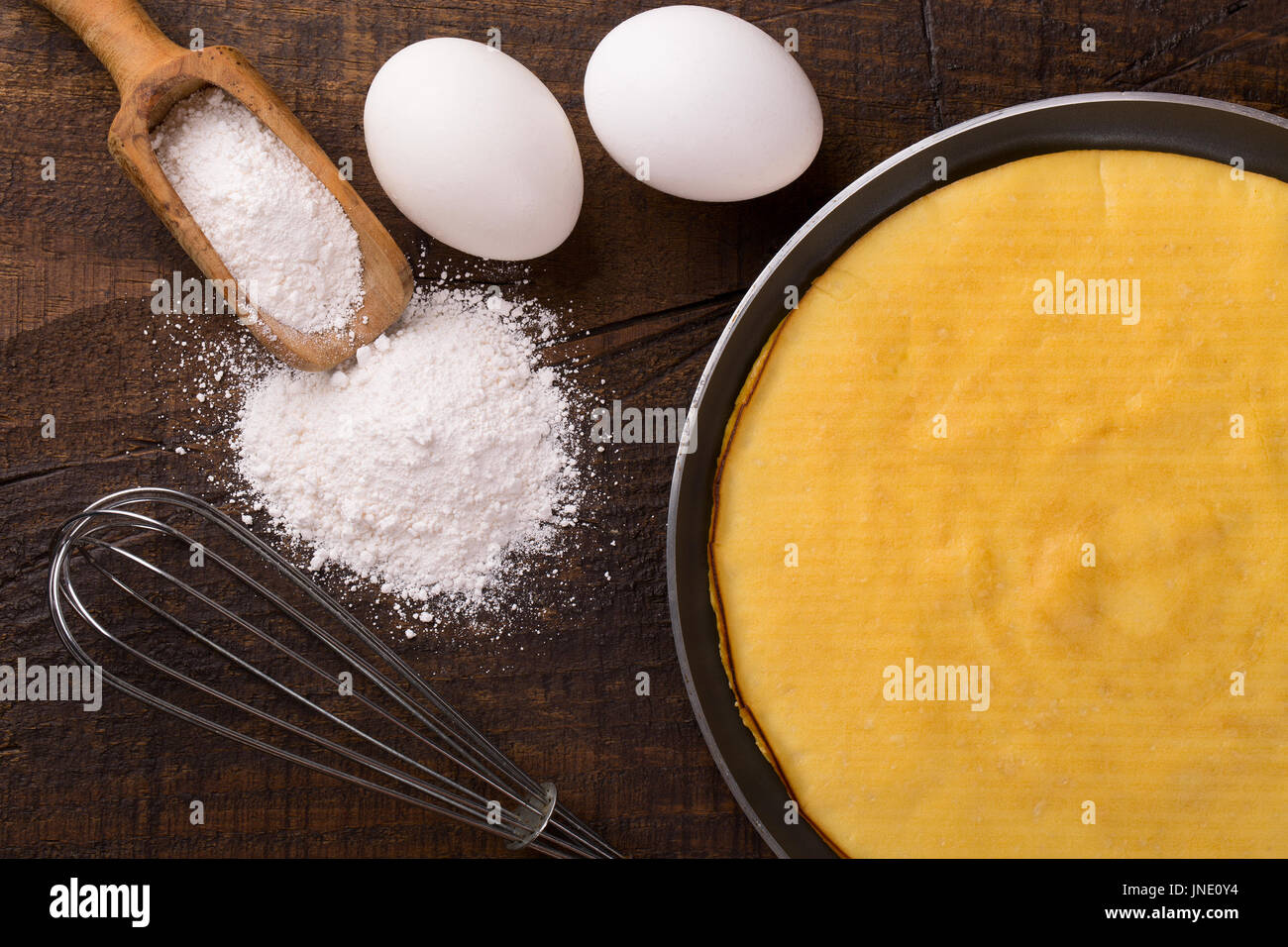 Cooking crepioca pancake of cassava (tapioca) glutenfree on wooden