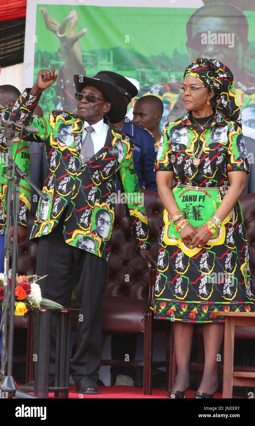 (170730) -- CHINHOYI (ZIMBABWE), July 30, 2017 (Xinhua) -- Zimbabwean President Robert Mugabe (L) and his wife Grace Mugabe attend a ZANU-PF rally in Chinhoyi, Mashonaland West, Zimbabwe, July 29, 2017. Zimbabwean President Robert Mugabe said on Saturday he is not about to step down leaving behind a fractured party. He said he was taking his time to anoint a successor until he is convinced that the party is united and that the person to succeed him has attained the same 'stature and acceptance as I have managed to secure over the years for the party'. (Xinhua/stringer) (zw) Stock Photo