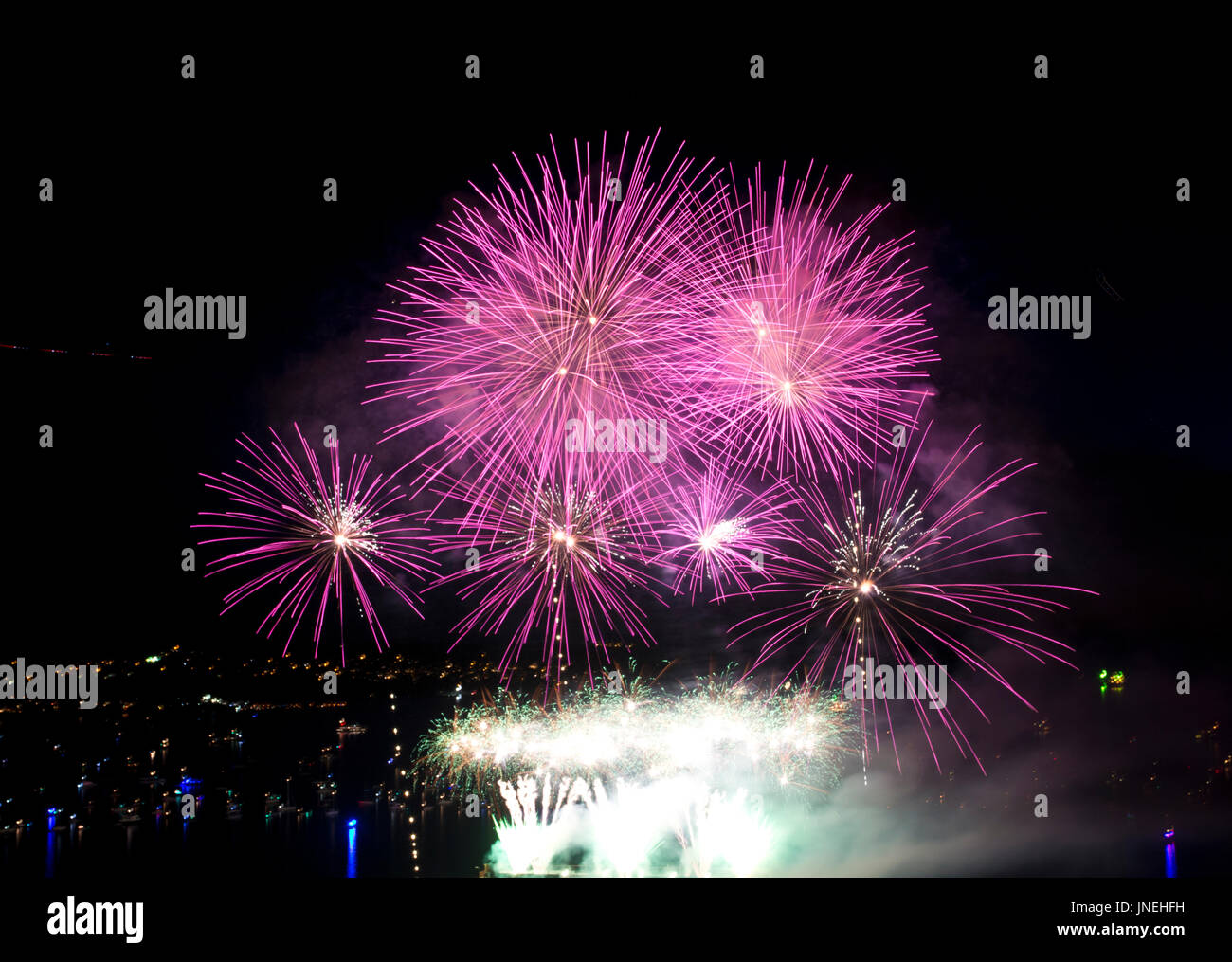 Vancouver, BC, Canada. 29th July, 2017. Bright pink fireworks burst in the sky above the waters of English Bay in Vancouver at the annual Honda Celebration of Light fireworks competition. Credit: Maria Janicki/Alamy Live News. Stock Photo